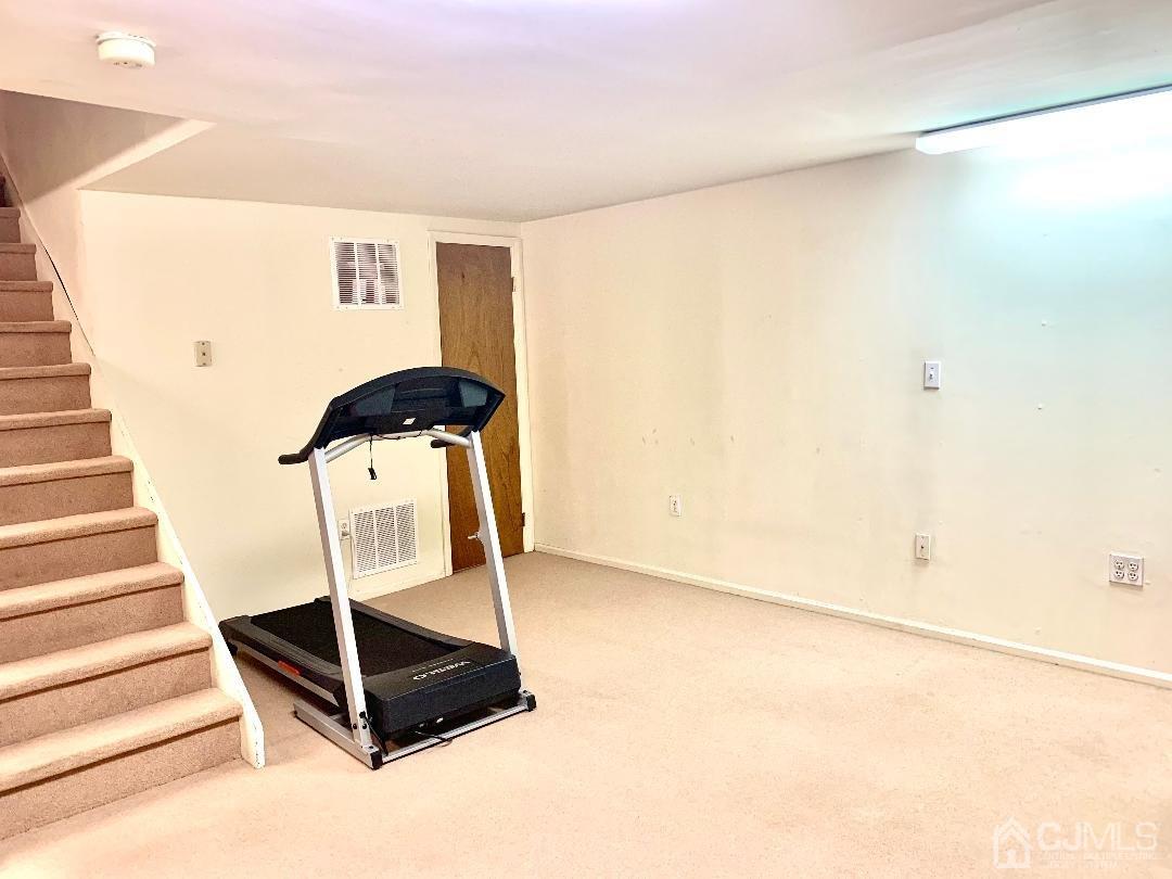 1001 Timber Oaks Road, Unit 1001 Edison, NJ 08820 - Photo 24 of 25 a view of a room with gym equipment