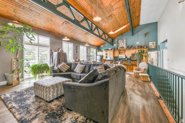 569 Elk Meadow Loop Tooele, UT 84074 - Photo 15 of 56 Living area featuring a skylight, a high wooden beamed ceiling, and wood finished floors