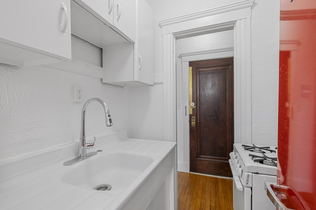 170 Maple Street, Unit 110 Malden, MA 02148 - Photo 12 of 23 a bathroom with a sink and a mirror