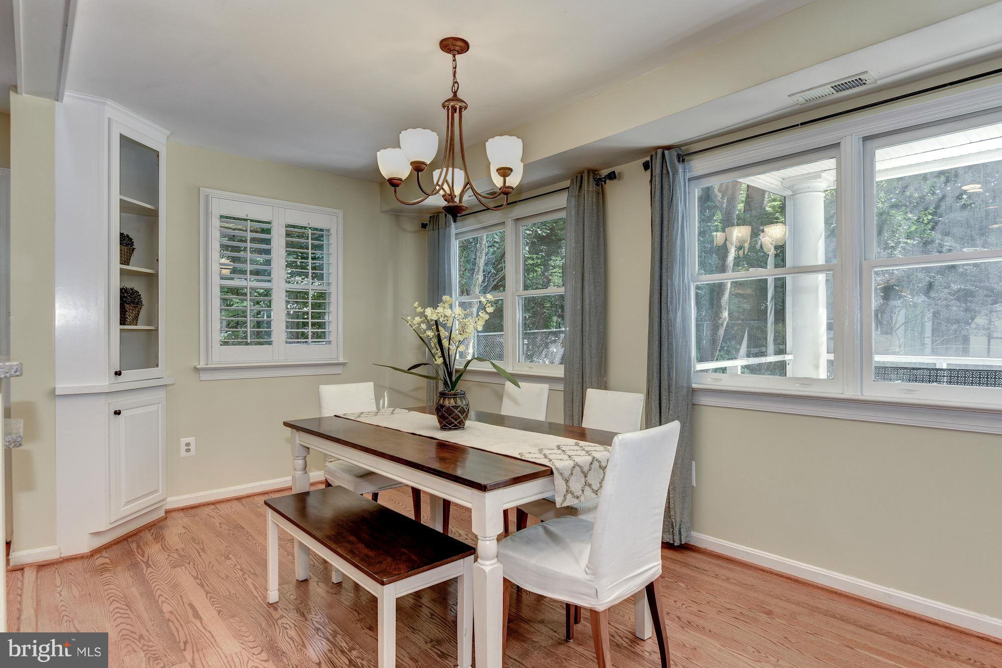 8807 Walnut Hill Road Chevy Chase, MD 20815 - Photo 6 of 21 Open and looking out to screen porch and deck
