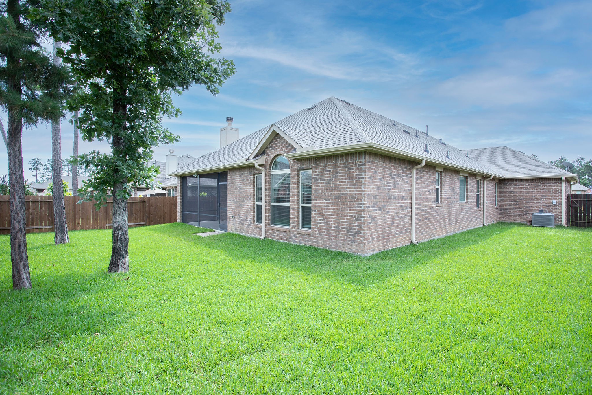 14014 Sand Ridge Crossing Conroe, TX 77384 - Photo 2 of 24 Nice size backyard with a screened patio for your entertainment!