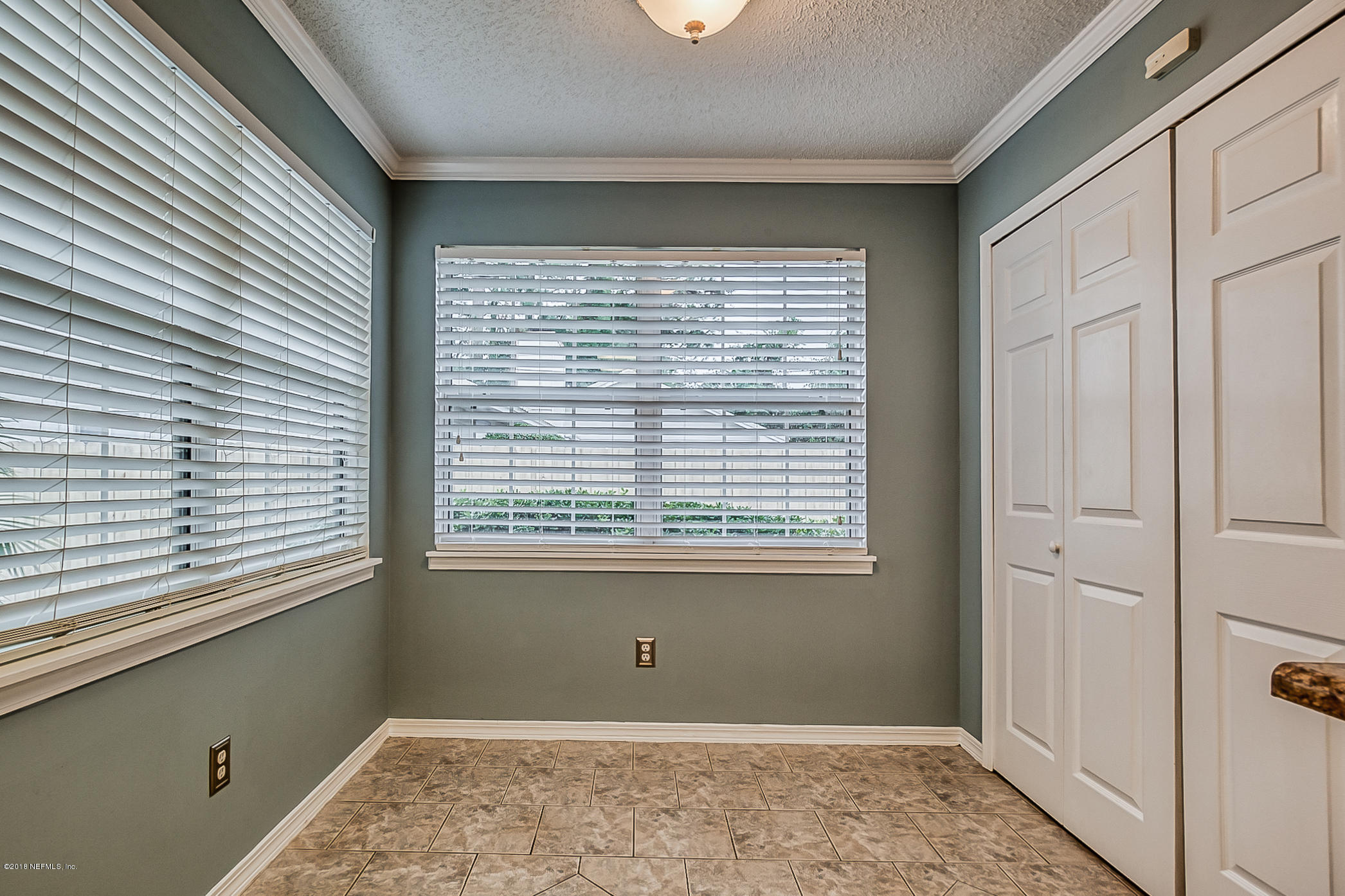 1513 Derringer Road Jacksonville, FL 32225 - Photo 24 of 37 a view of an empty room with a window