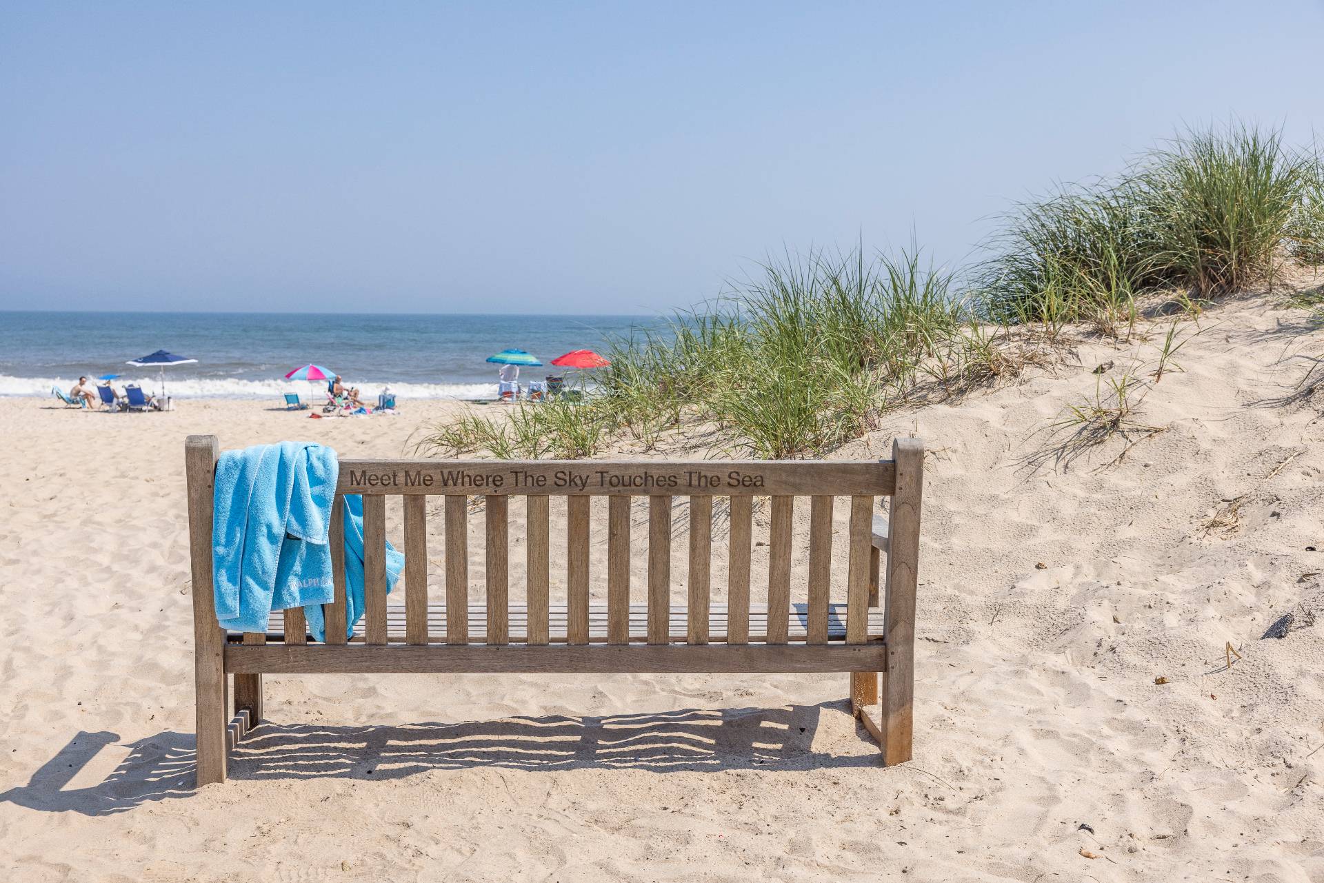 89 Sayre's Path Wainscott, NY 11975 - Photo 8 of 12 a wooden bench sitting in the middle of a yard