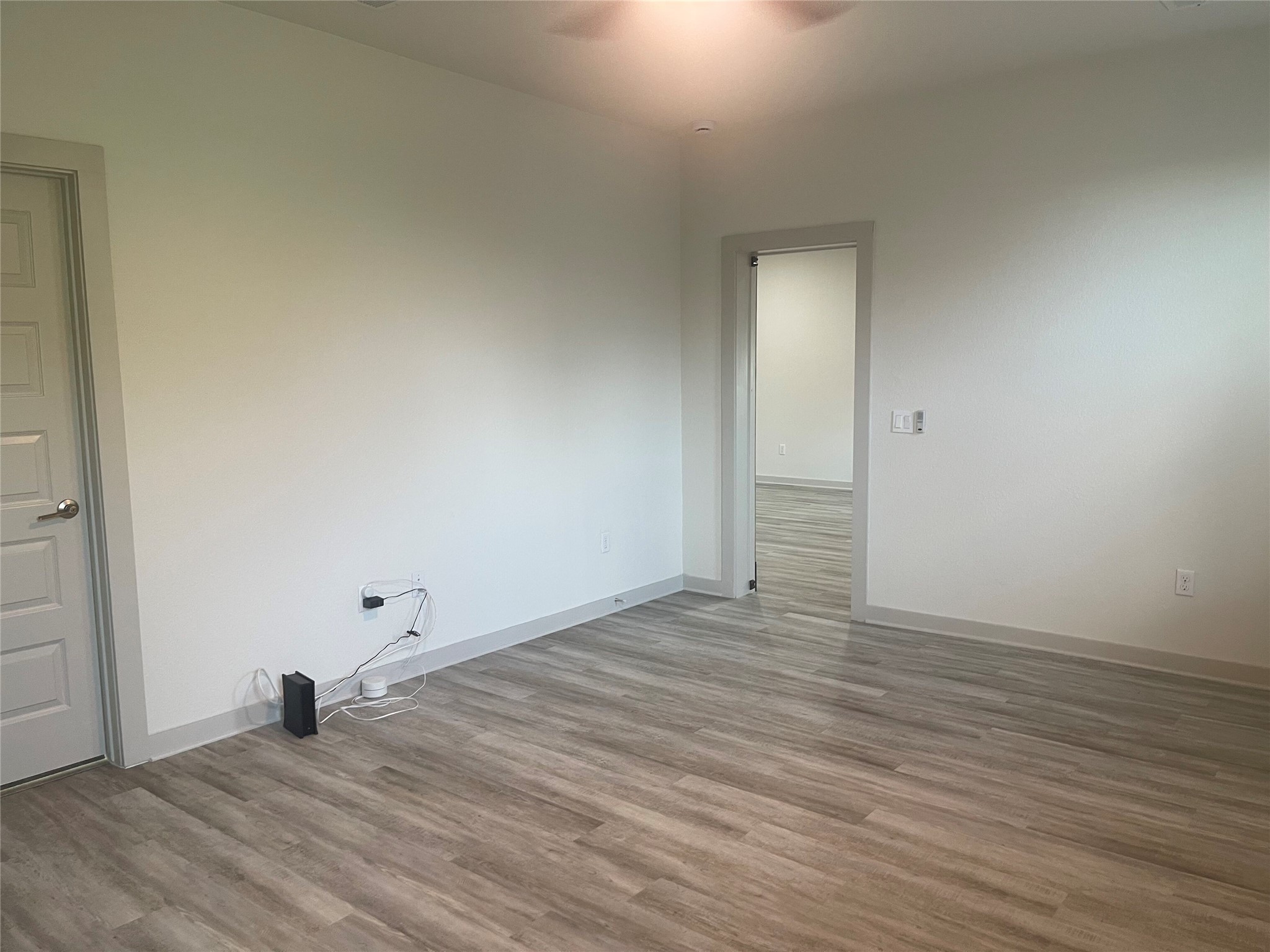 145 Merrick Road Georgetown, TX 78628 - Photo 22 of 32 Smooth walls and classic wood flooring define this versatile interior space.