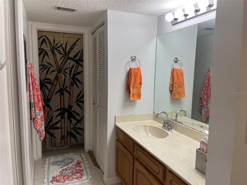 23465 Harbor View Road, Unit 1006 Punta Gorda, FL 33980 - Photo 21 of 41 a bathroom with a sink and a mirror