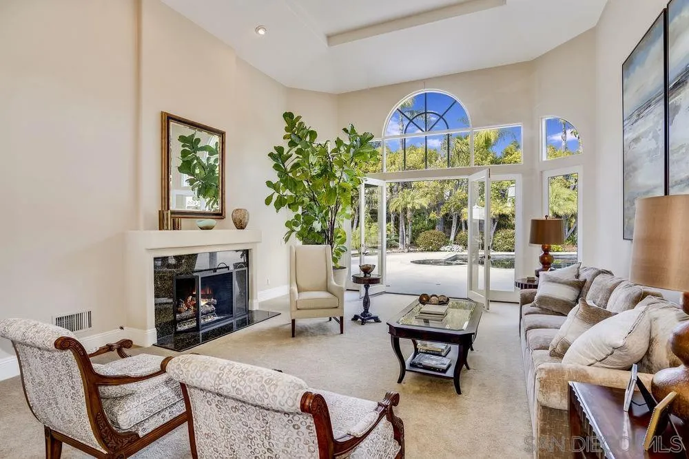 7745 St Andrews Road Rancho Santa Fe, CA 92067 - Photo 6 of 29 a living room with furniture and a fireplace