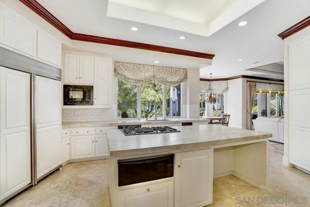7745 St Andrews Road Rancho Santa Fe, CA 92067 - Photo 9 of 29 a kitchen with stainless steel appliances a stove sink and microwave