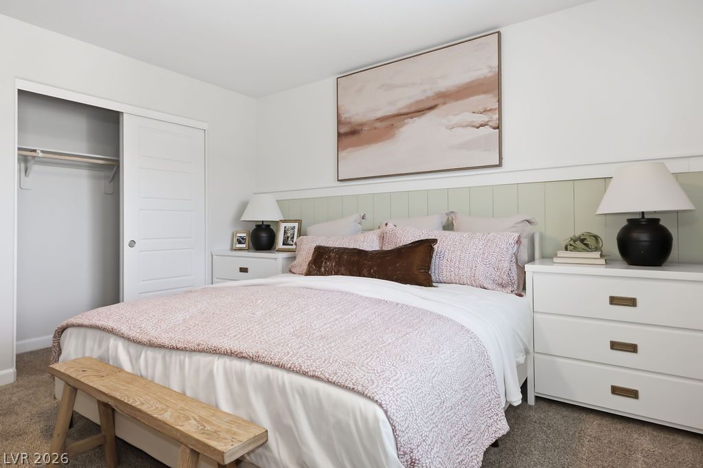913 Cadence View Way Henderson, NV 89011 - Photo 28 of 46 Plush carpeting and a charming paneled headboard define this comfortable sleeping space.