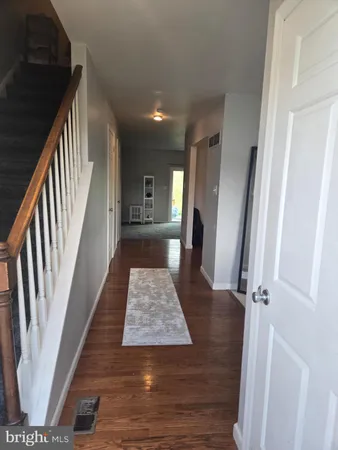 wooden floor with a rug