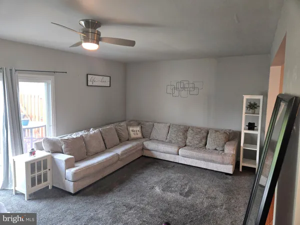 a living room with furniture and a couch