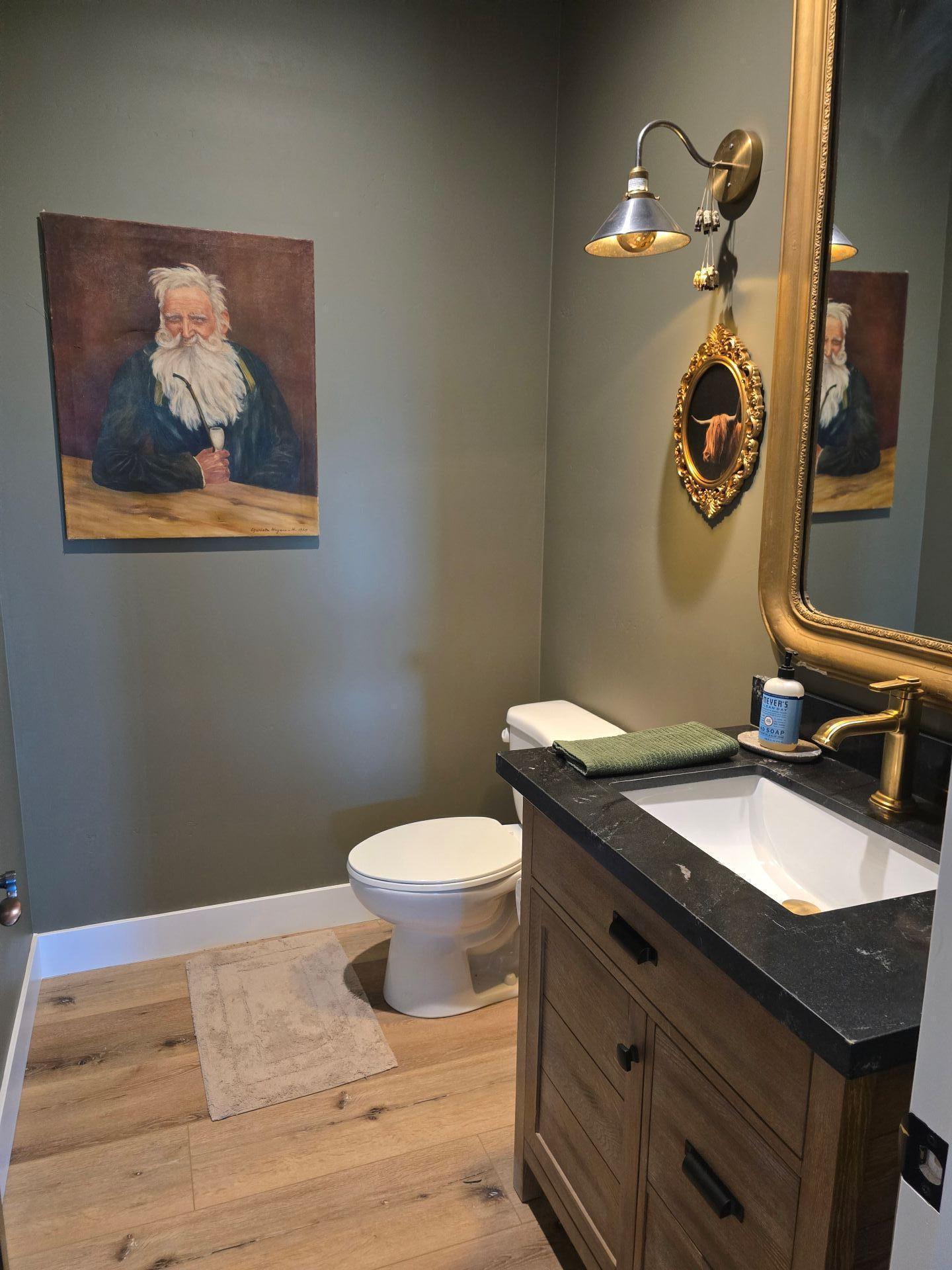240 Rockinghorse Bend Road Payson, AZ 85541 - Photo 34 of 53 a bathroom with a granite countertop toilet sink and mirror