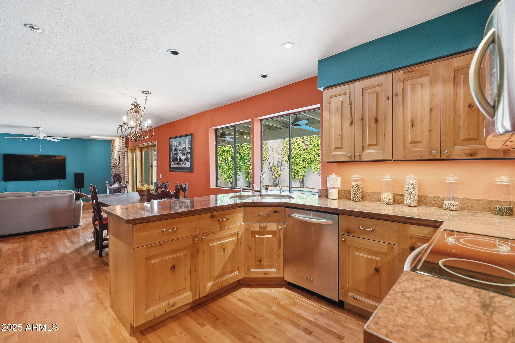 1608 East Edgewater Drive Tempe, AZ 85283 - Photo 15 of 47 a kitchen with lots of counter top space and wooden floor