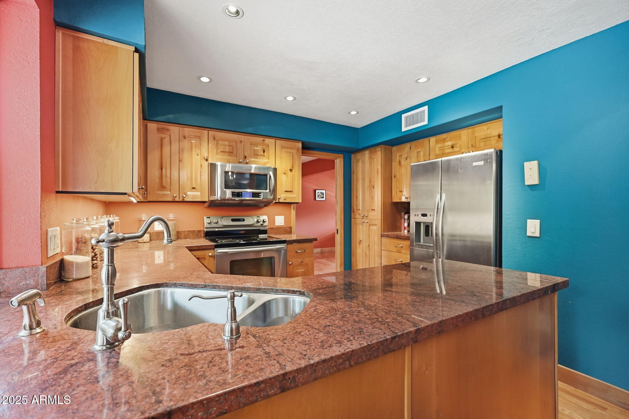 1608 East Edgewater Drive Tempe, AZ 85283 - Photo 17 of 47 a kitchen with granite countertop a sink and a stove top oven