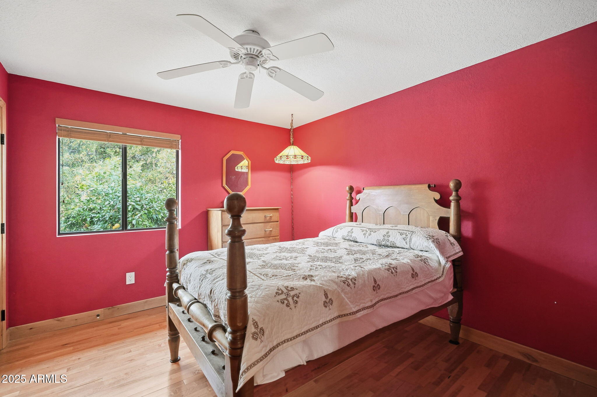 1608 East Edgewater Drive Tempe, AZ 85283 - Photo 27 of 47 a bedroom with a bed and a chandelier