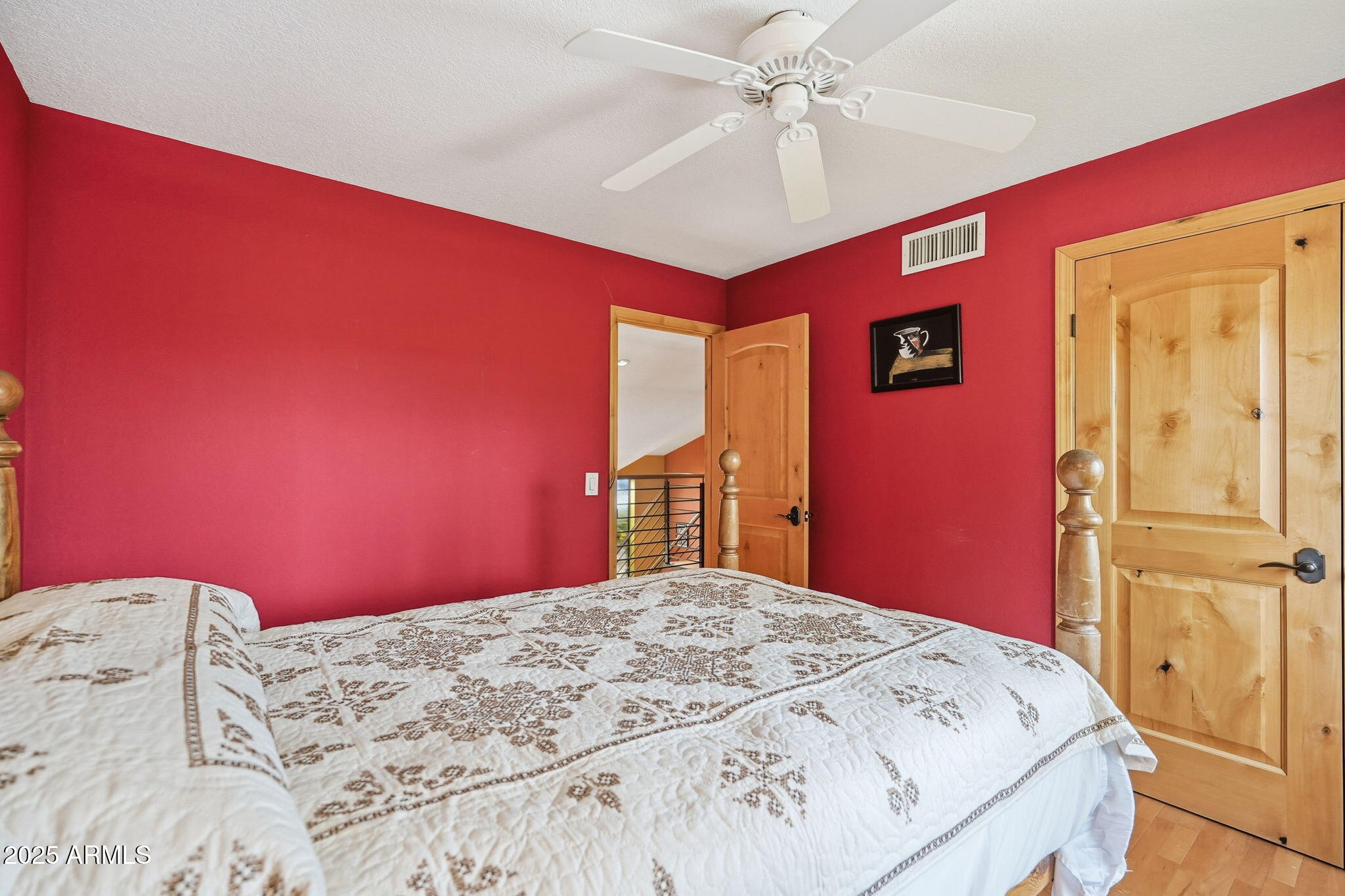 1608 East Edgewater Drive Tempe, AZ 85283 - Photo 28 of 47 a bedroom with a large bed and a chandelier