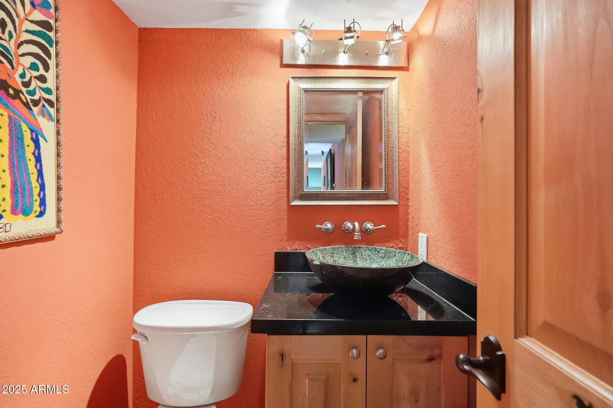 1608 East Edgewater Drive Tempe, AZ 85283 - Photo 37 of 47 a bathroom with a toilet sink and mirror