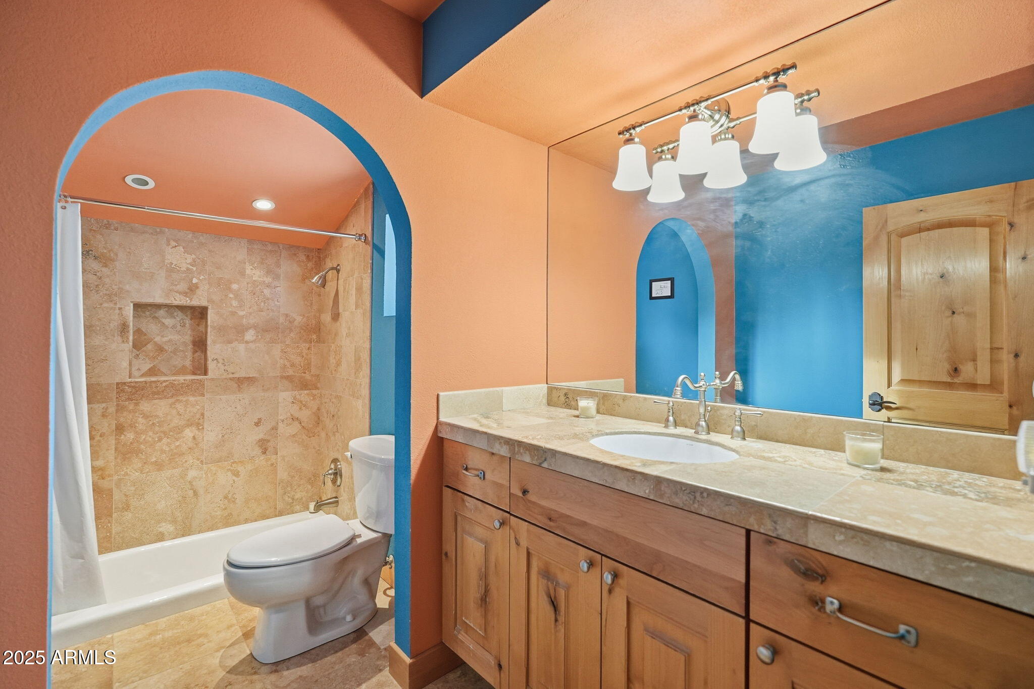 1608 East Edgewater Drive Tempe, AZ 85283 - Photo 38 of 47 a bathroom with a toilet a sink and a large mirror