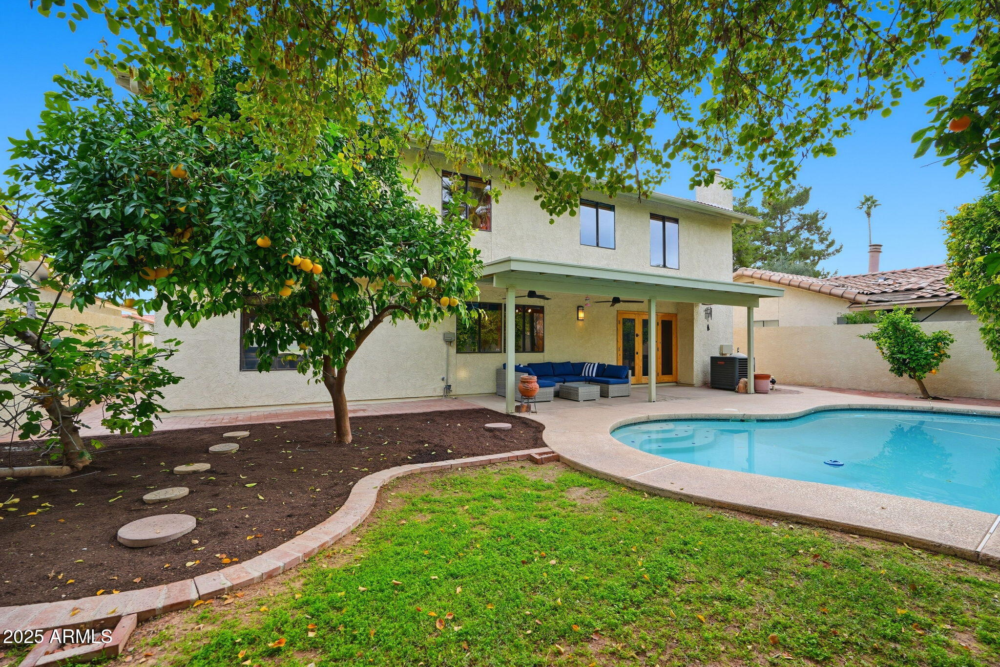 1608 East Edgewater Drive Tempe, AZ 85283 - Photo 5 of 47 a view of a house with backyard sitting area and garden