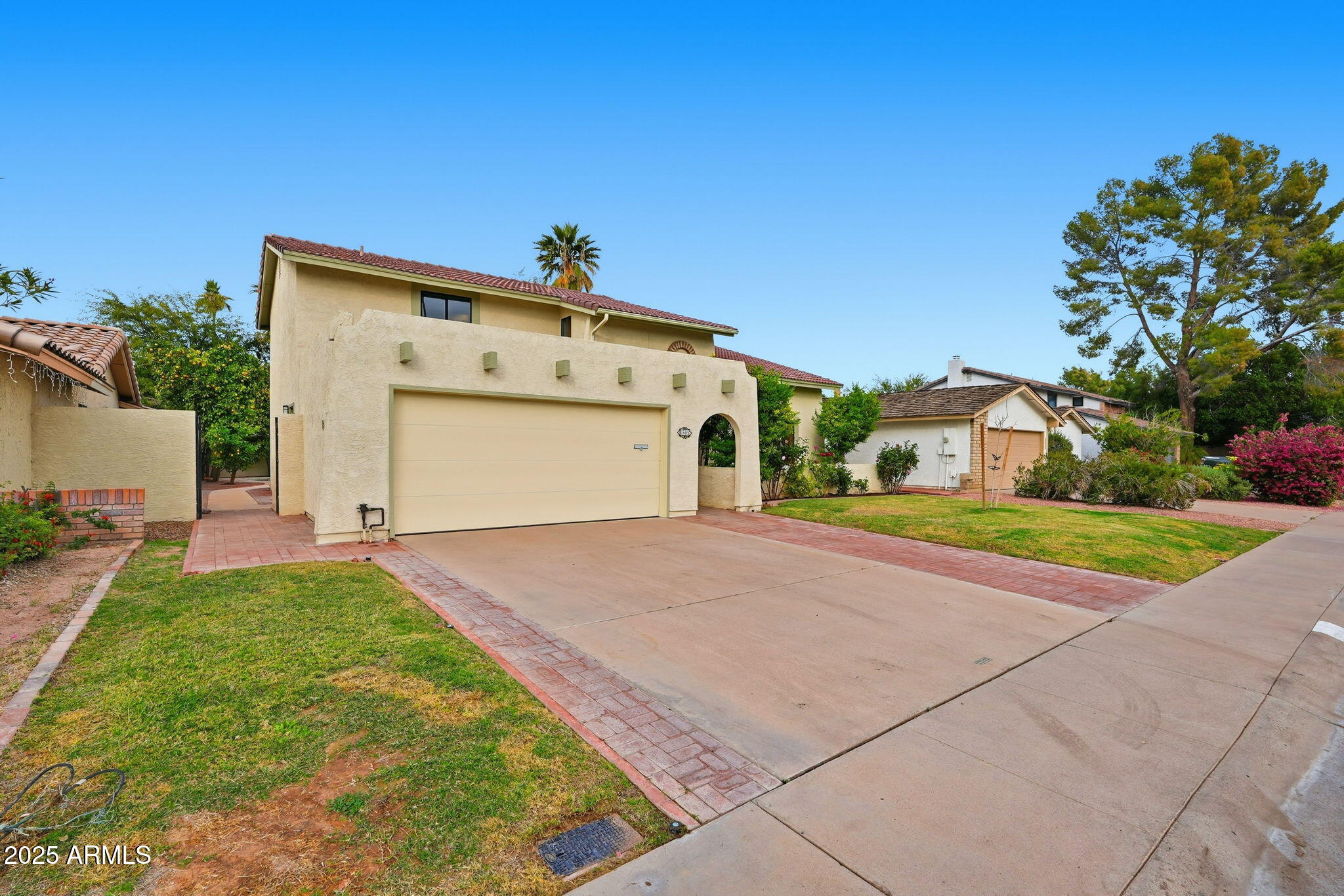 1608 East Edgewater Drive Tempe, AZ 85283 - Photo 7 of 47 a front view of a house with a yard and garage