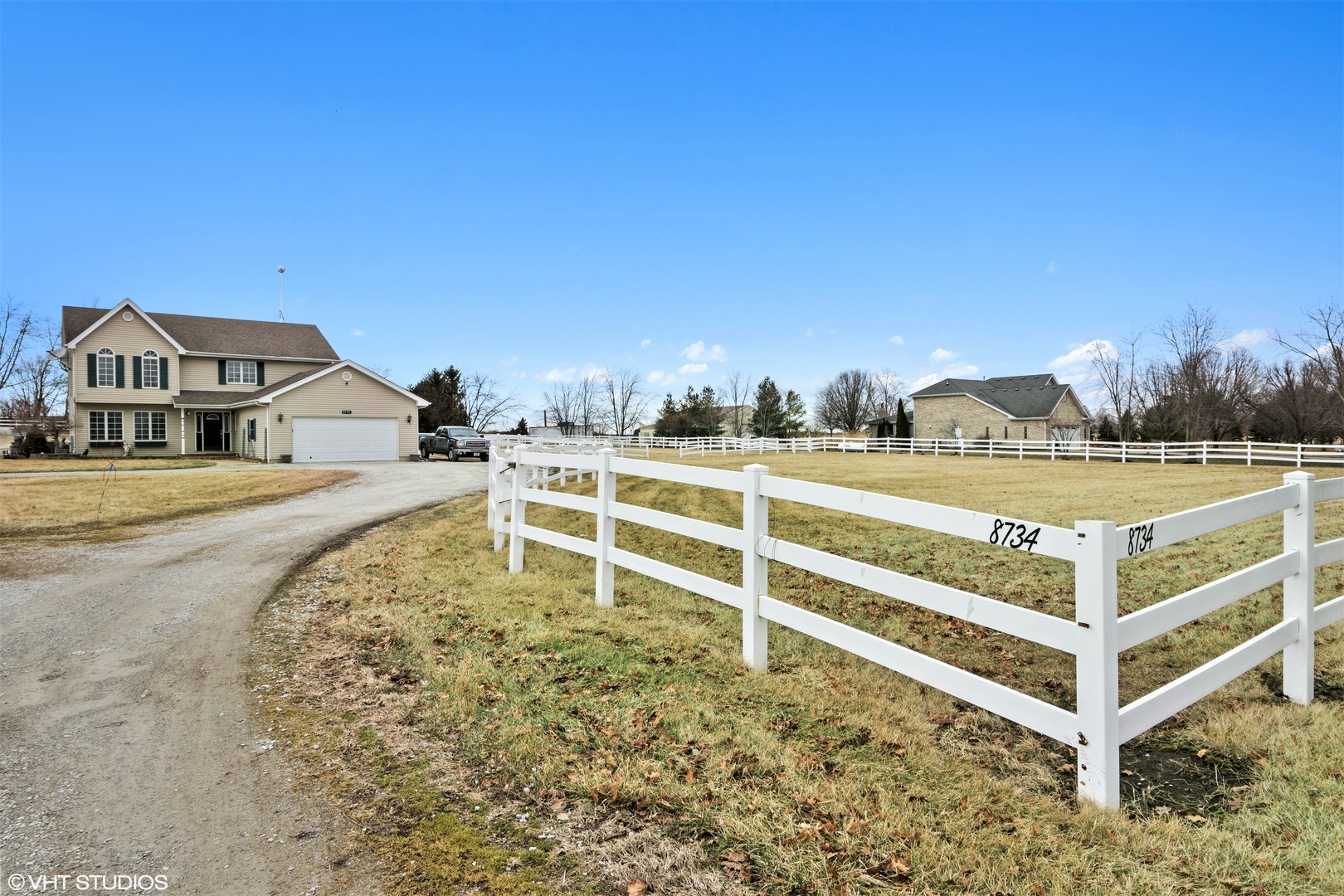 a view of a house with a yard from a balcony