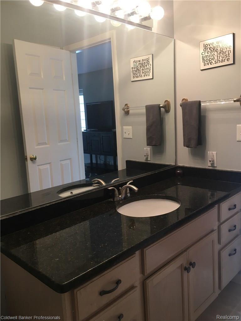4941 South Crooks Road Royal Oak, MI 48073 - Photo 11 of 18 Bathroom has granite and plenty of storage
