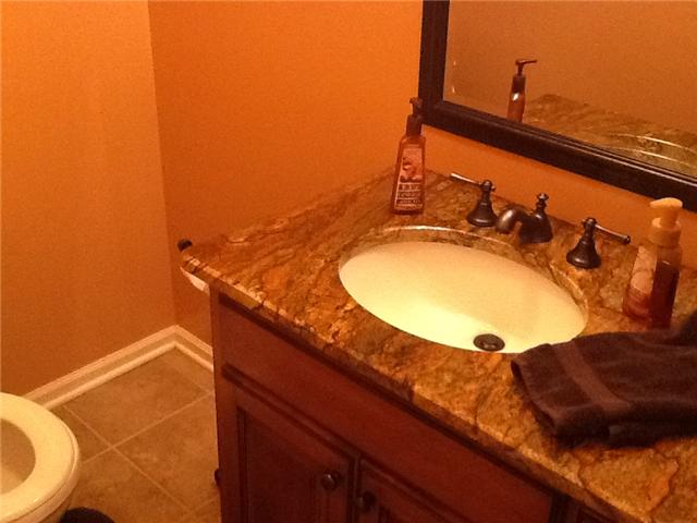 3441 Pleasant Grove Road White House, TN 37188 - Photo 11 of 20 Half bath on main floor off of laundry area. You will love the warm caramel color of this bathroom.