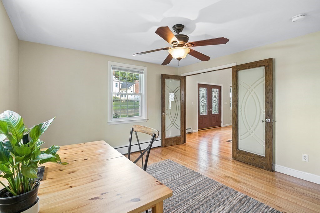 146 Ridge Street Winchester, MA 01890 - Photo 13 of 40 a view of a livingroom with wooden floor and a ceiling fan