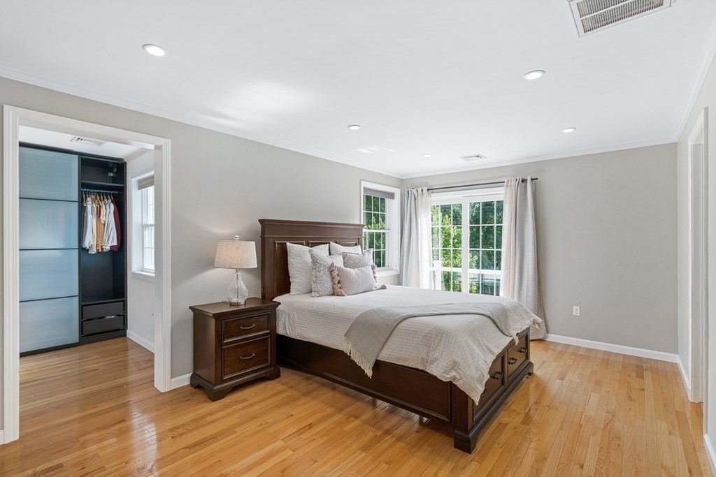 146 Ridge Street Winchester, MA 01890 - Photo 15 of 40 a bedroom with a bed and wooden floor