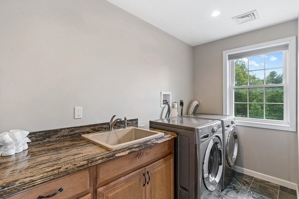 146 Ridge Street Winchester, MA 01890 - Photo 27 of 40 a utility room with sink dryer and washer