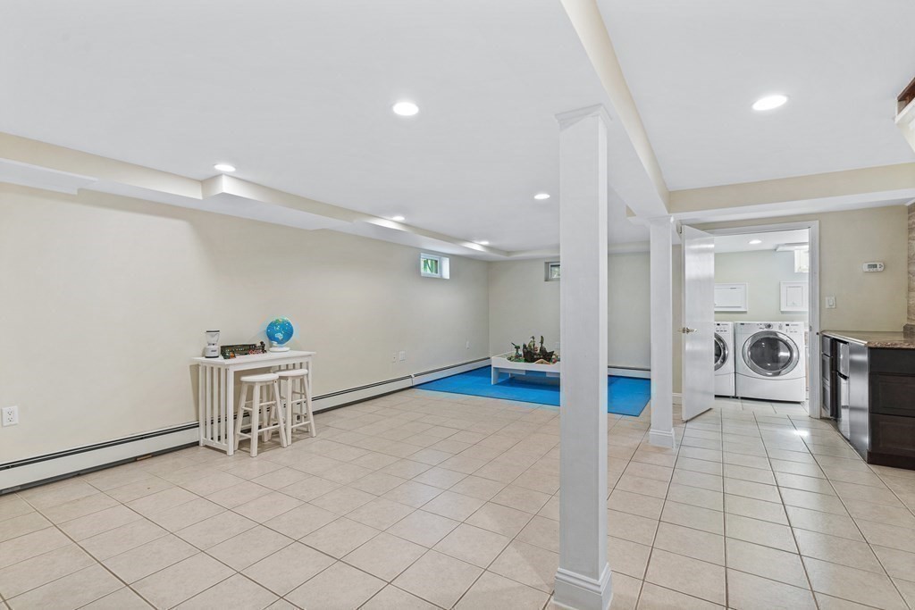 146 Ridge Street Winchester, MA 01890 - Photo 30 of 40 a view of a hallway with cabinet and a potted plant