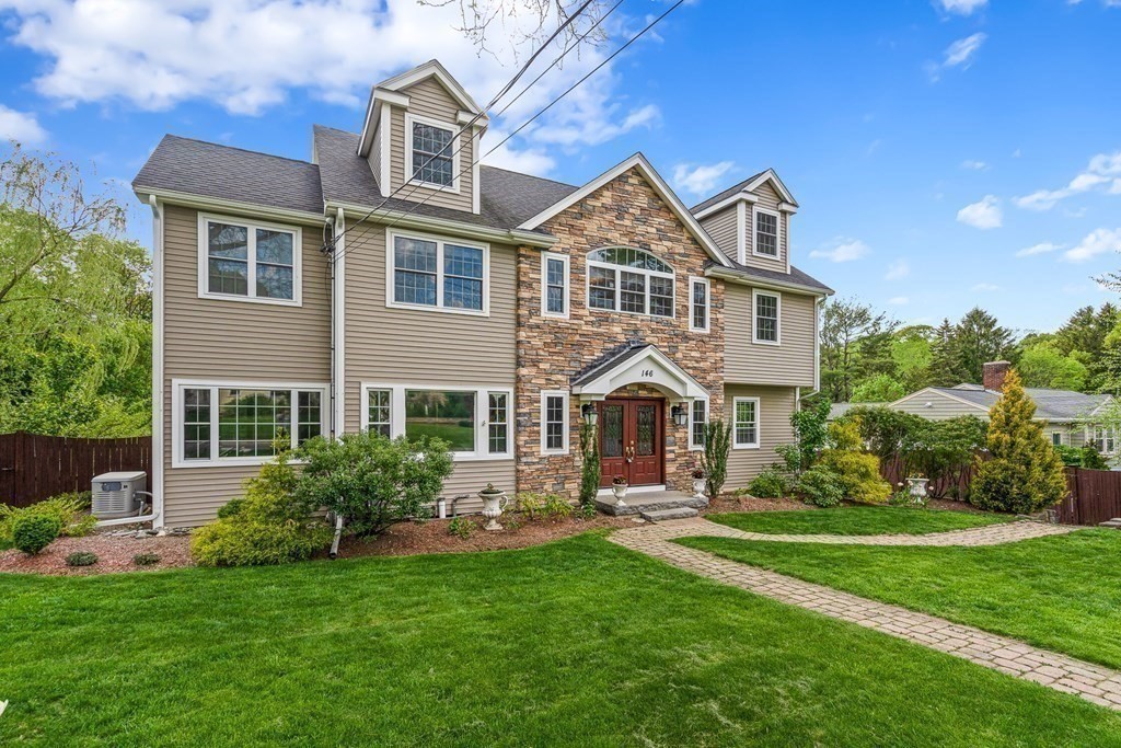 146 Ridge Street Winchester, MA 01890 - Photo 37 of 40 a front view of a house with a yard