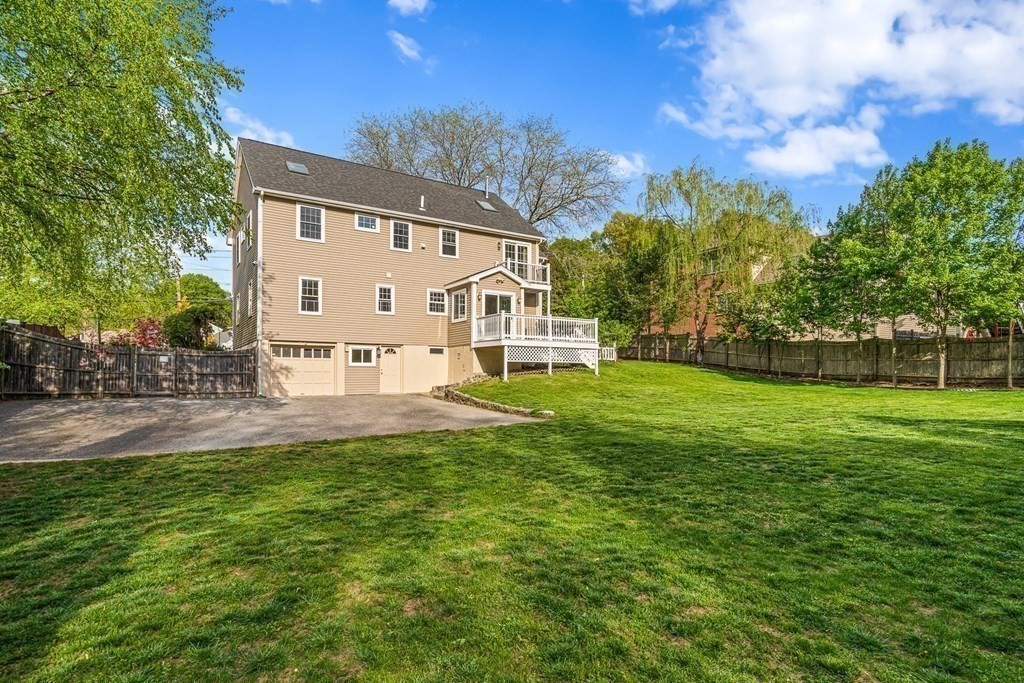 146 Ridge Street Winchester, MA 01890 - Photo 38 of 40 a view of a house with a back yard