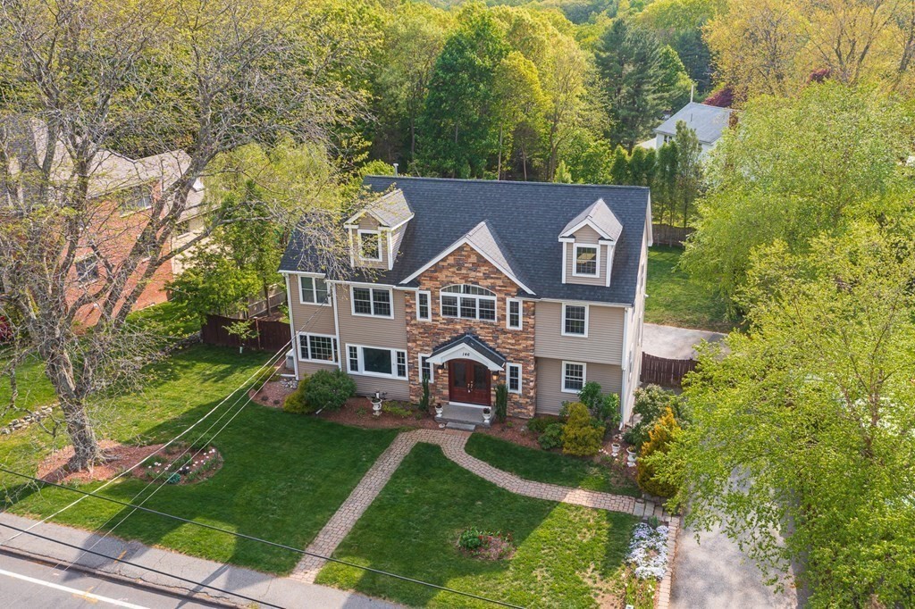 146 Ridge Street Winchester, MA 01890 - Photo 40 of 40 front view of a house with a yard