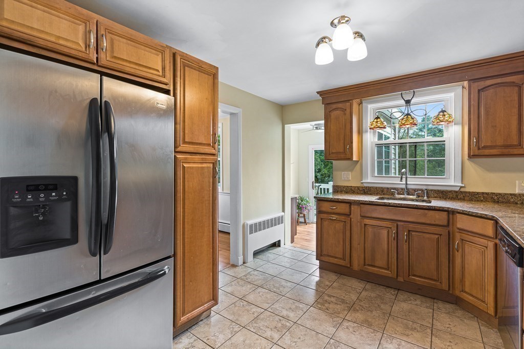 146 Ridge Street Winchester, MA 01890 - Photo 9 of 40 a kitchen with a refrigerator and countertop sink