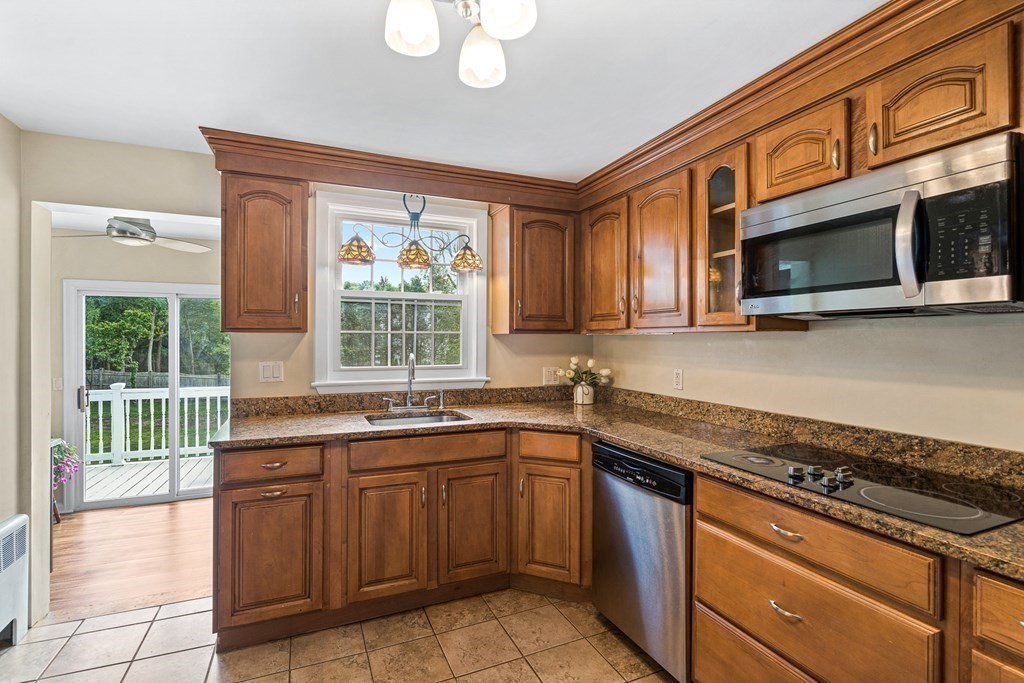 146 Ridge Street Winchester, MA 01890 - Photo 10 of 40 a kitchen with stainless steel appliances granite countertop a sink stove and microwave