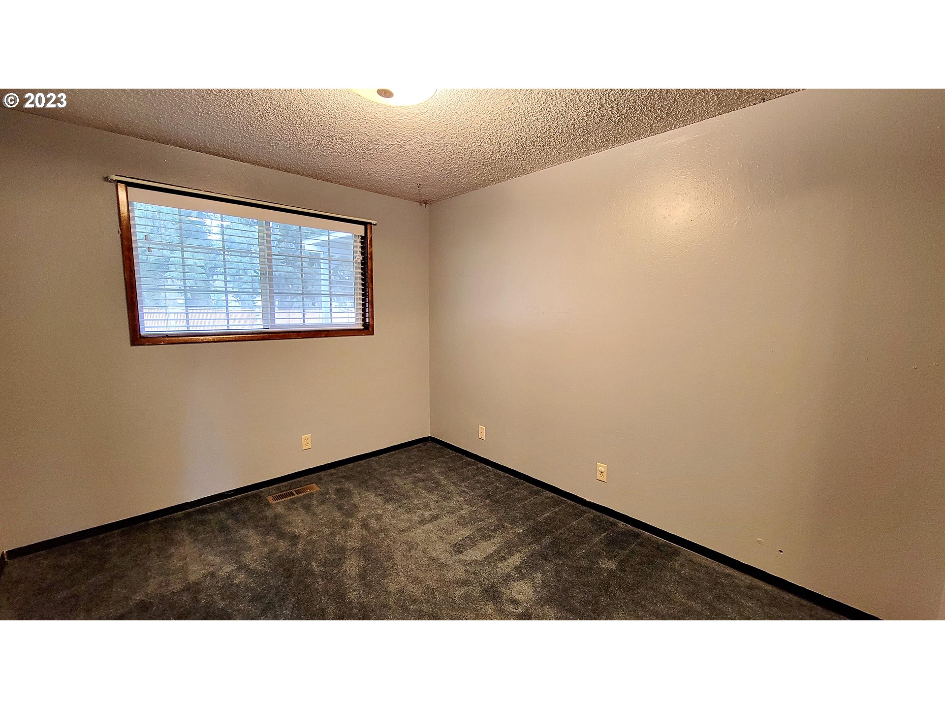 726 Rayner Avenue Springfield, OR 97477 - Photo 12 of 19 a black and white photo of a big room