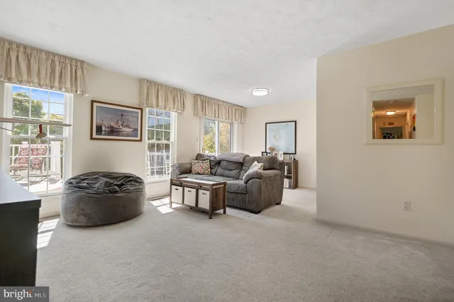 a view of a roof deck with table and chairs with wooden floor and fence