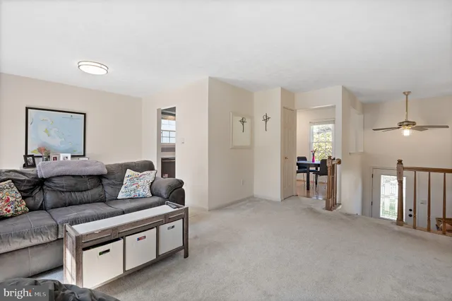 a kitchen with a refrigerator a stove top oven a sink and cabinets