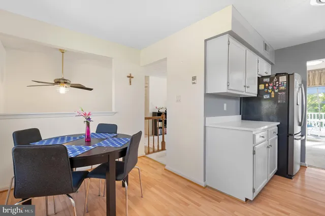 a living room with furniture a fireplace and a large window