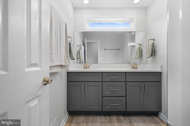 a bedroom with furniture and a wooden floor