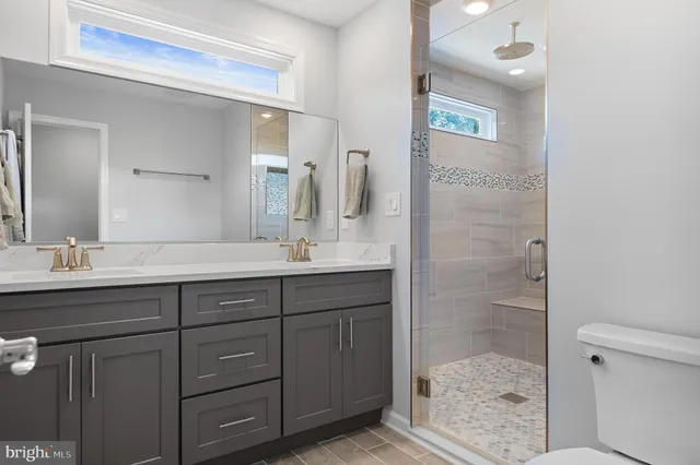 a living room with a fireplace a large window and a fireplace