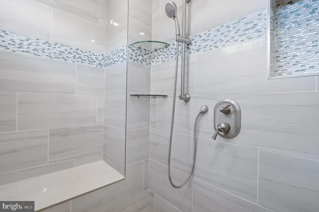 a room with furniture a rug and a window