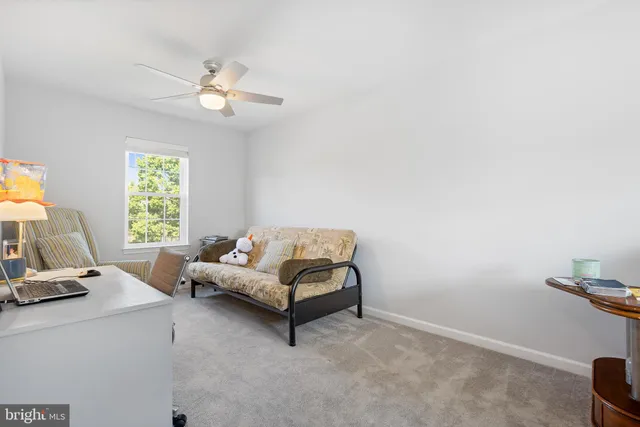 an aerial view of a house with a yard and garden