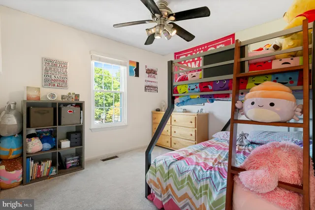 a view of a chairs and table in backyard of the house