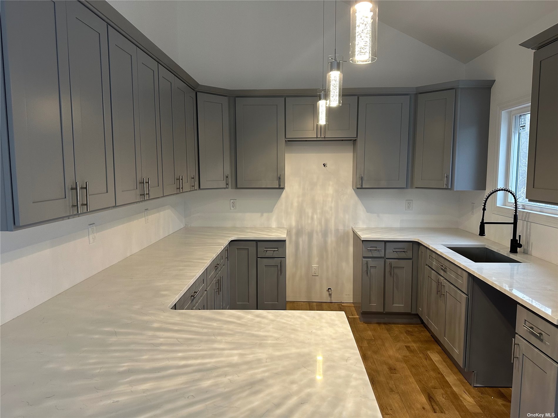 a kitchen with a sink and cabinets