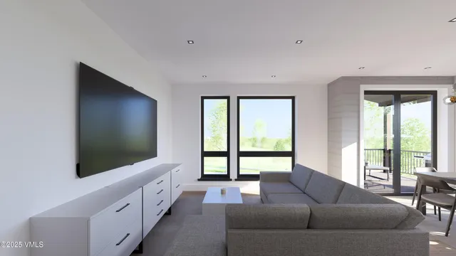 a view of a dining room with furniture large windows and wooden floor