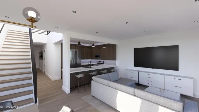 a living room with flat screen tv and furniture