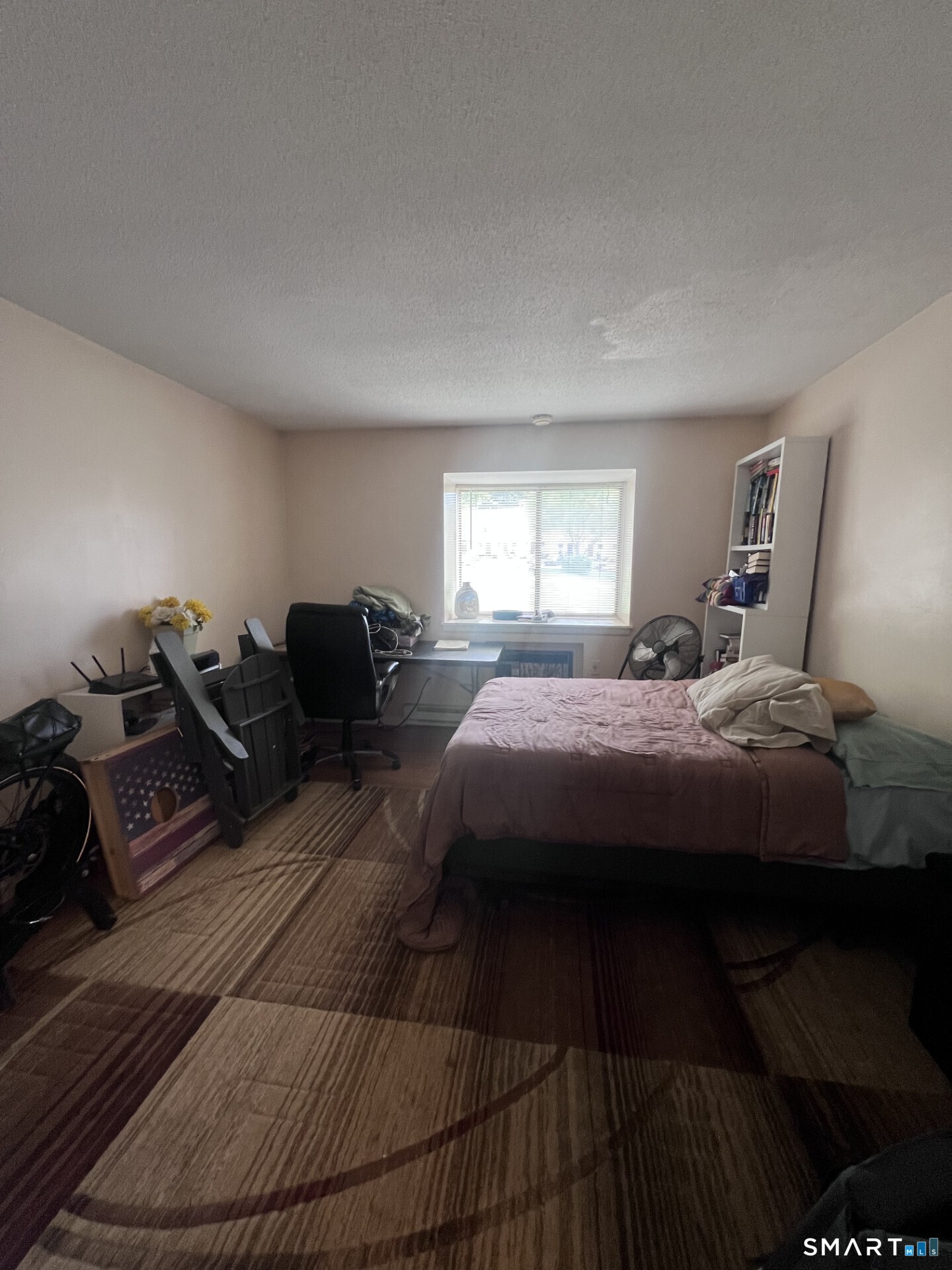 93 Kent Court, Unit 93 Meriden, CT 06450 - Photo 16 of 27 a bedroom with a bed and wooden floor