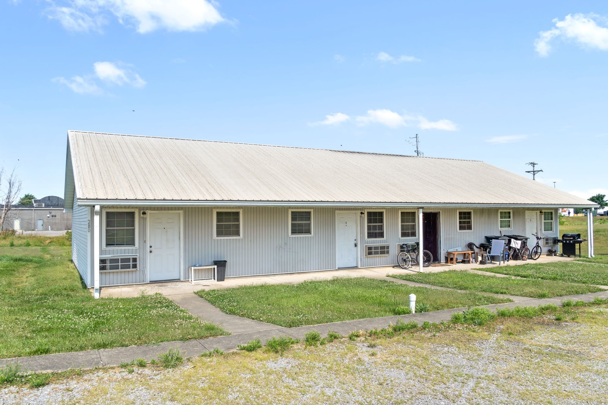 a front view of house with yard and green space