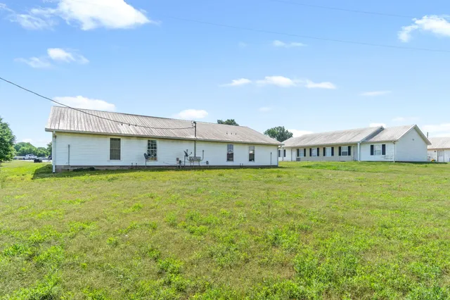 a view of a golf course with a big yard